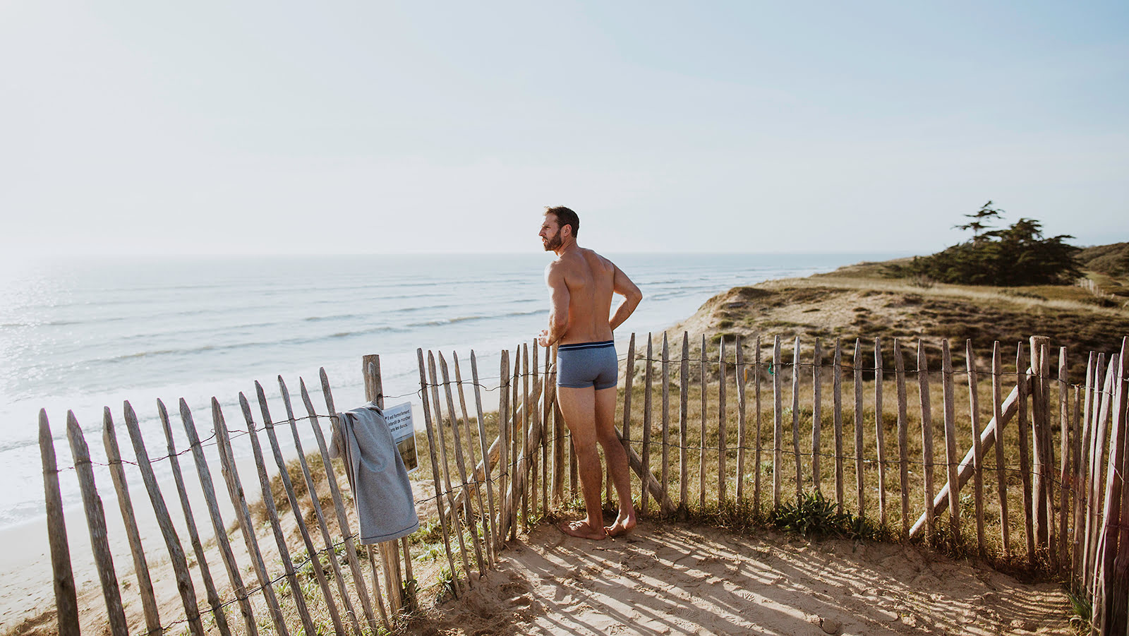 man wearing bluebuck underwear by the sea