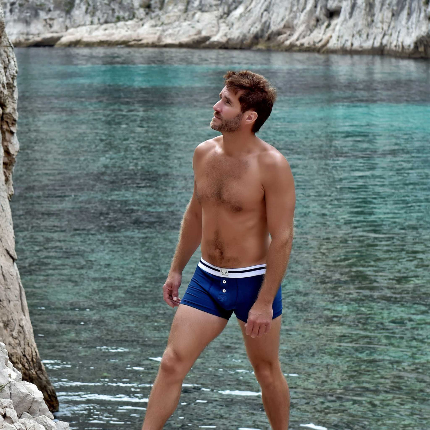 Navy blue organic cotton men's trunks with white buttons